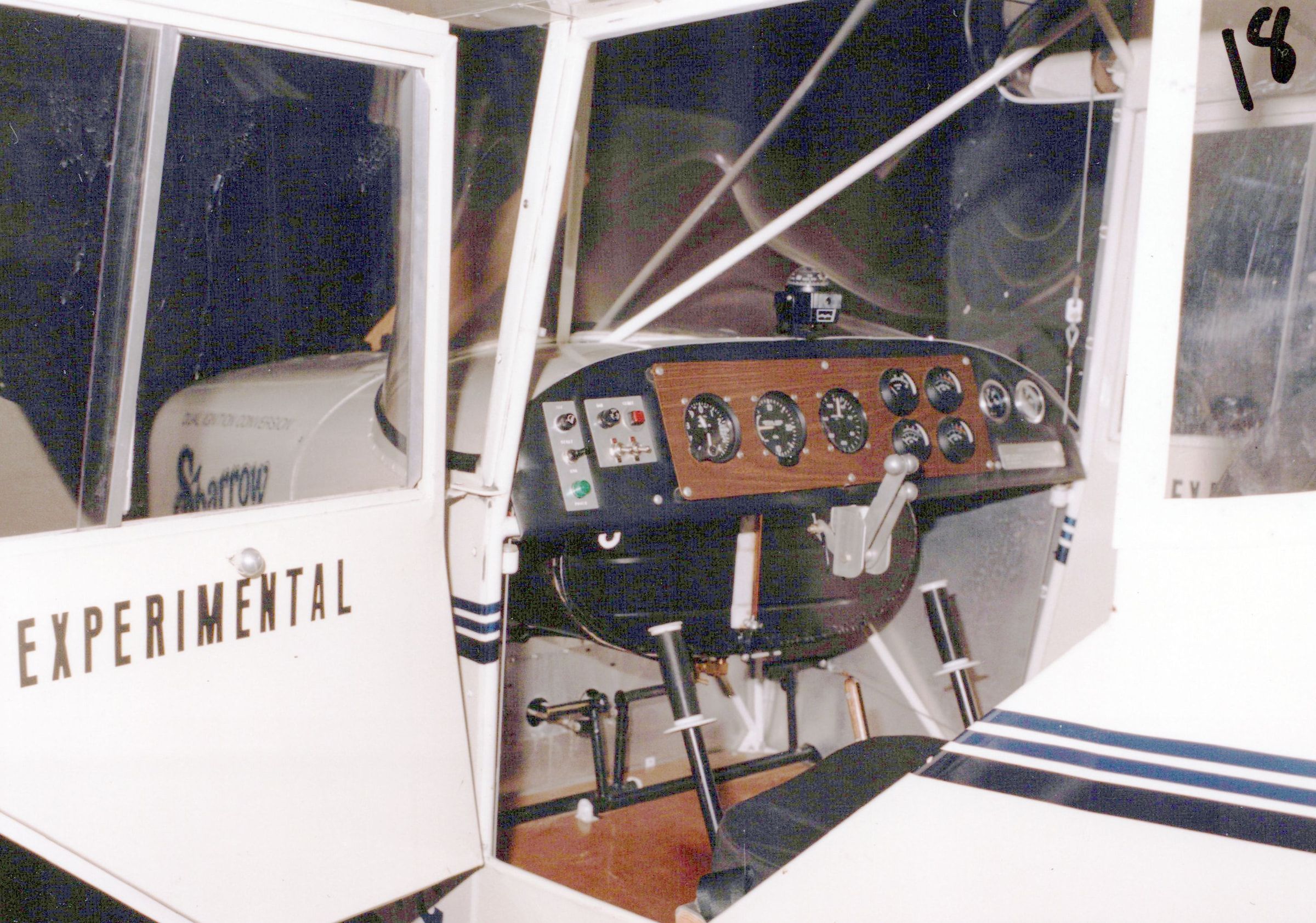 Side-by-side cockpit of a Carlson Sparrow II with dual control sticks and instrument panel
