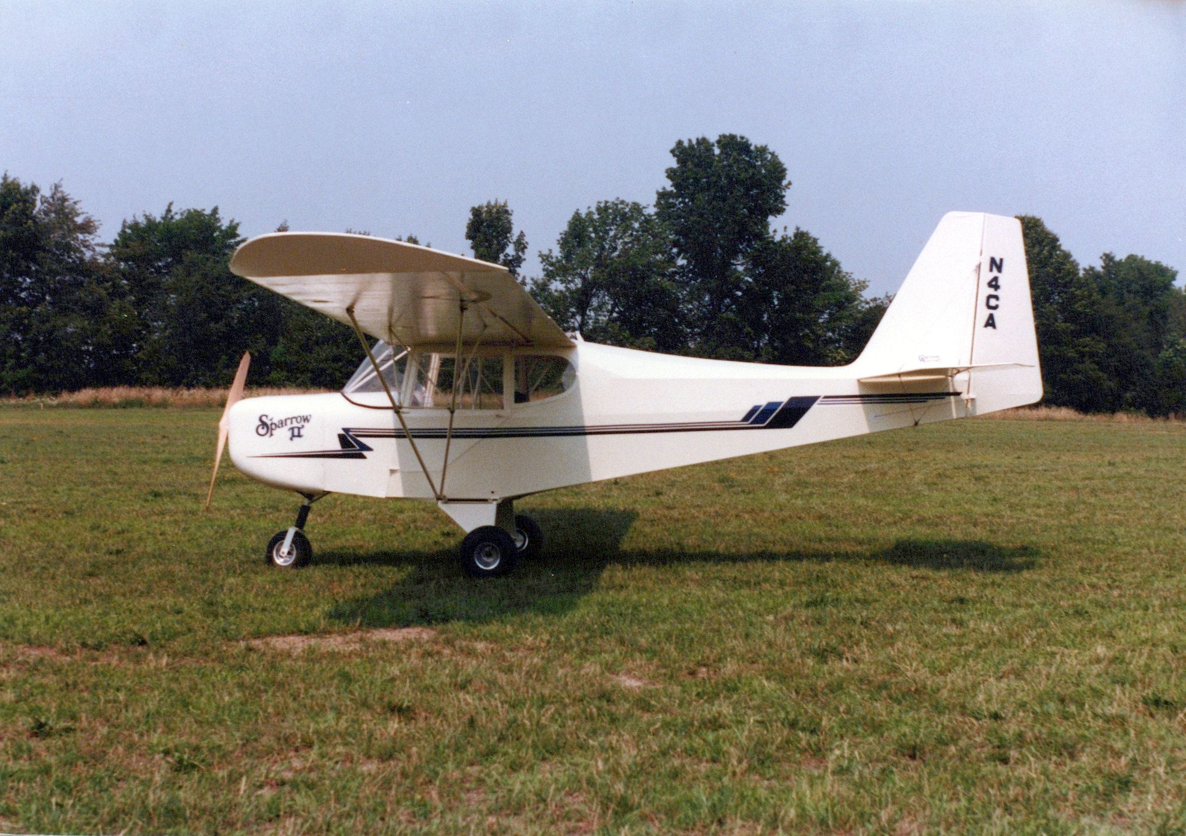 Profile of a white Carlson Sparrow II on grass