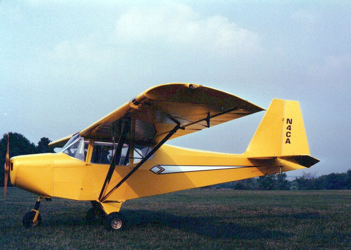 Three-quarter view of the yellow Carlson Sparrow II XTC demonstrator N4CA