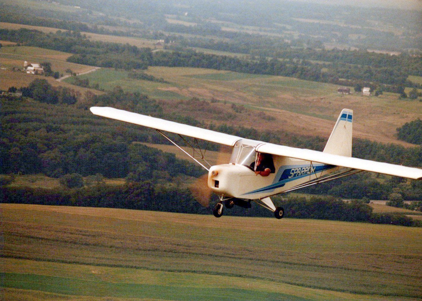 Carlson Sparrow Ultralight flying low over farmland